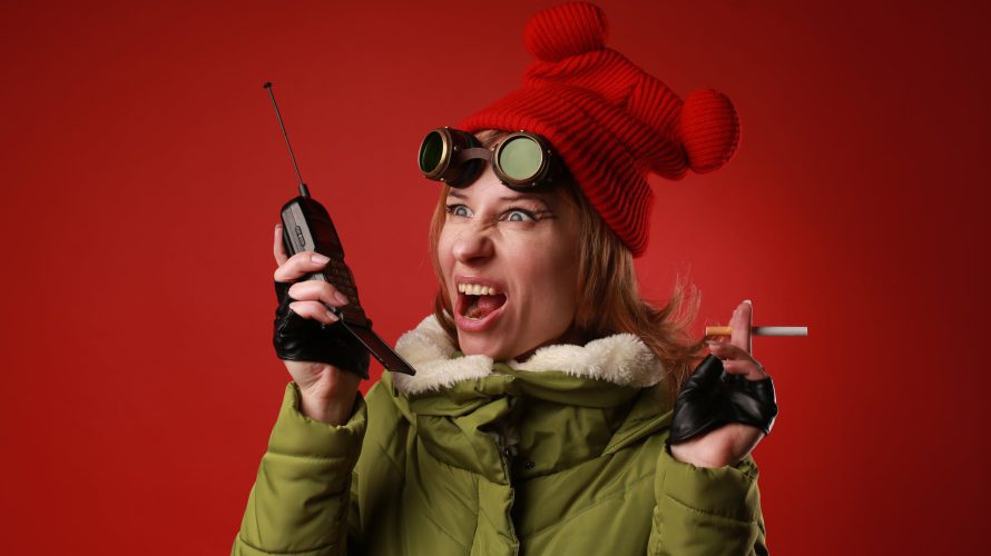 angry woman with cigarette screaming into portable transceiver
